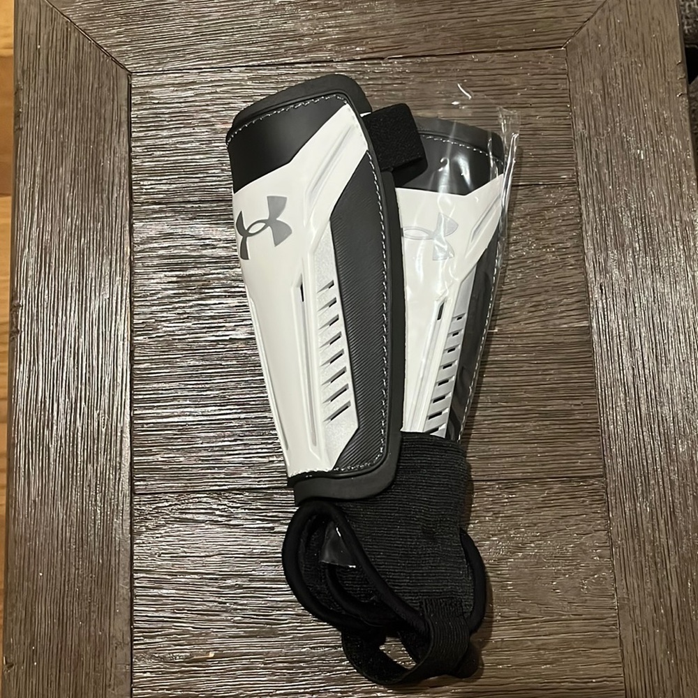 New never worn Under Armour  both Left and Right shin guards